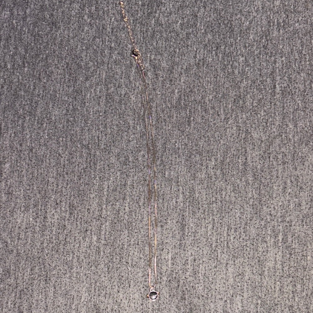 Elegant Gold Necklace with Saturn Pendant